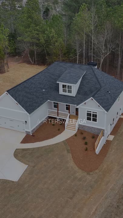 Aerial view of a white craftsman ranch home in Cartersville, Georgia